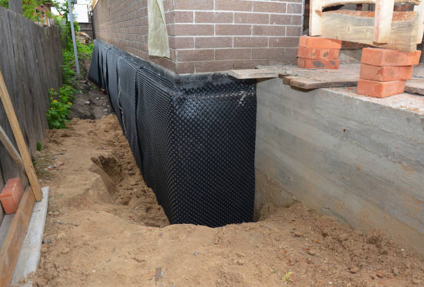 Happy homeowners after waterproofing job in Hartselle